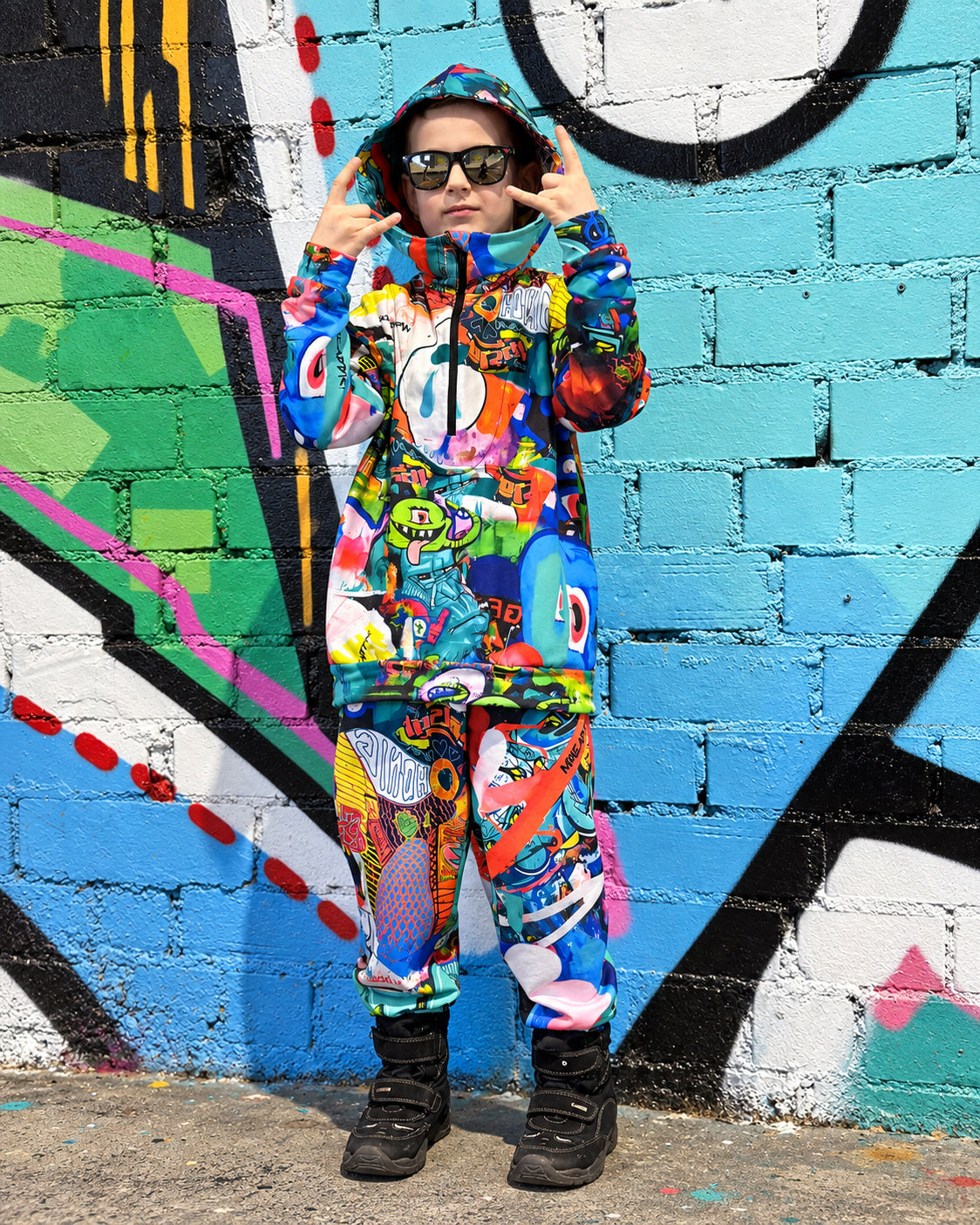 Child wearing MoveAddict Monster Party print kids' oversized hoodie - front view