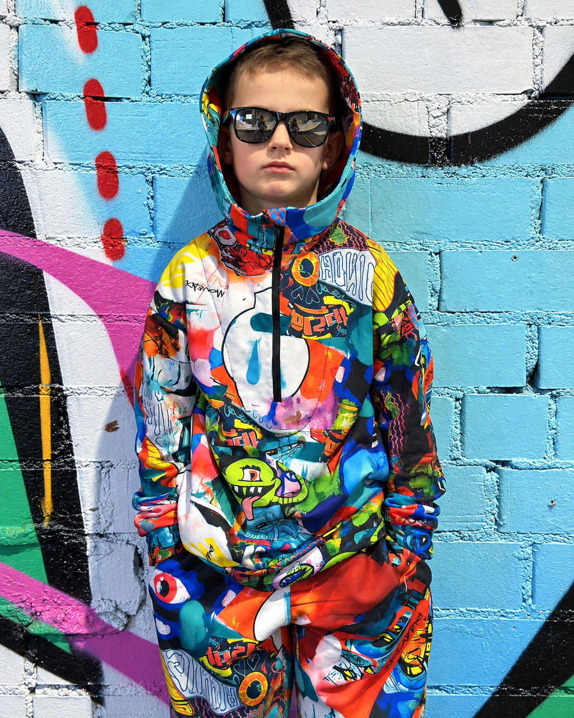 Child wearing MoveAddict Monster Party print kids' oversized hoodie - portrait