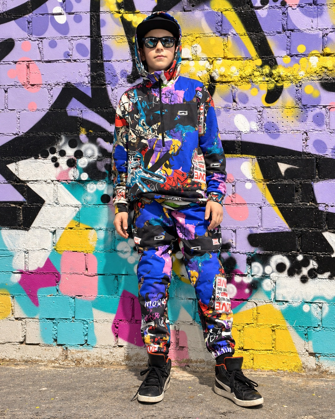 Child wearing MoveAddict Love and Peace print kids' oversized hoodie - front view, photo 2