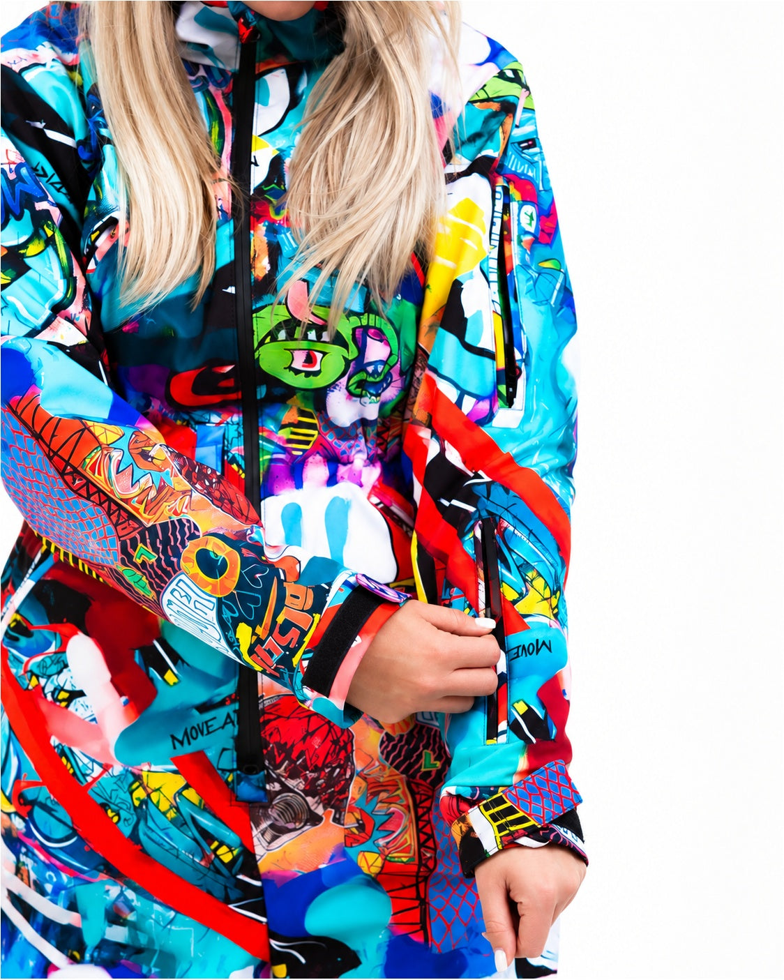 Close-up of zipped chest pockets on MoveAddict Monster Party print women's snowsuit