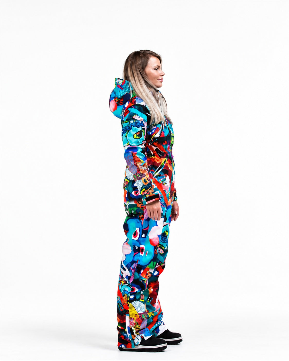 Woman wearing MoveAddict Monster Party print one-piece snowboard and ski suit – side view, photo 2