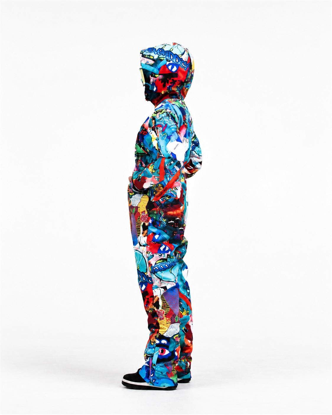 Woman wearing MoveAddict Monster Party print women's snowsuit with hood up – side view