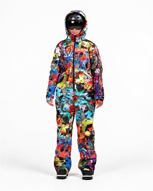 Woman wearing MoveAddict Mind Jungle print one-piece snowboard and ski suit – front view, studio photo