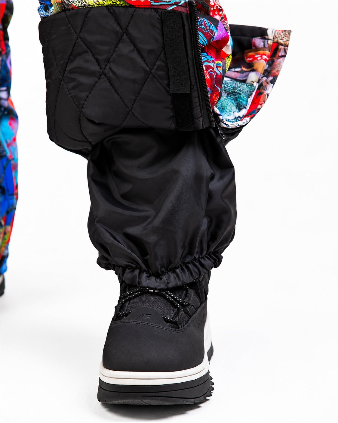 Boot gaiter close-up on MoveAddict Mind Jungle print women's snowsuit