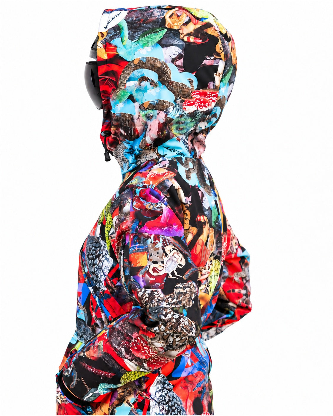 Woman wearing MoveAddict Mind Jungle print women's snowsuit with hood up – side view