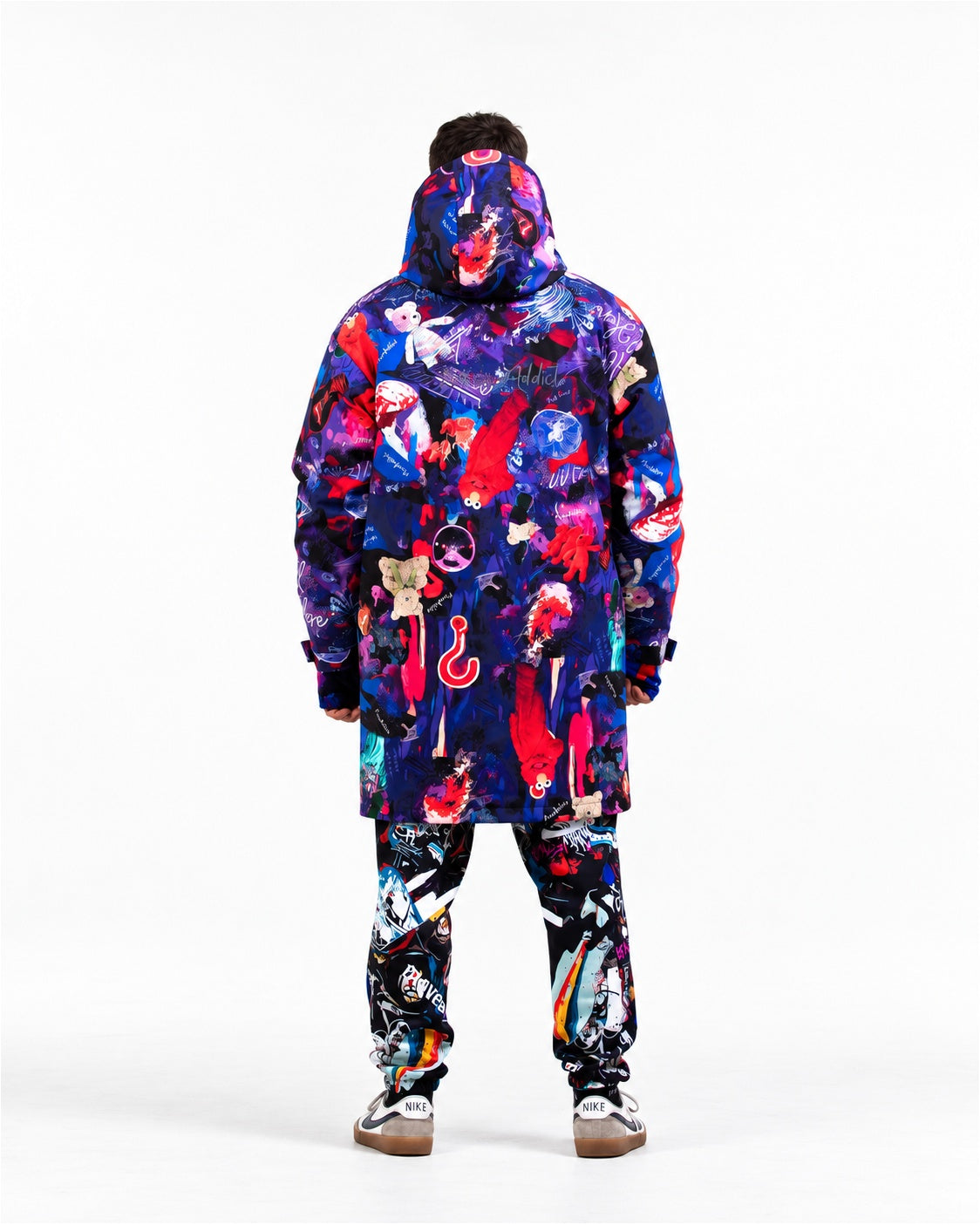 Man wearing MoveAddict Midnight Madness print winter parka with hood up – back view