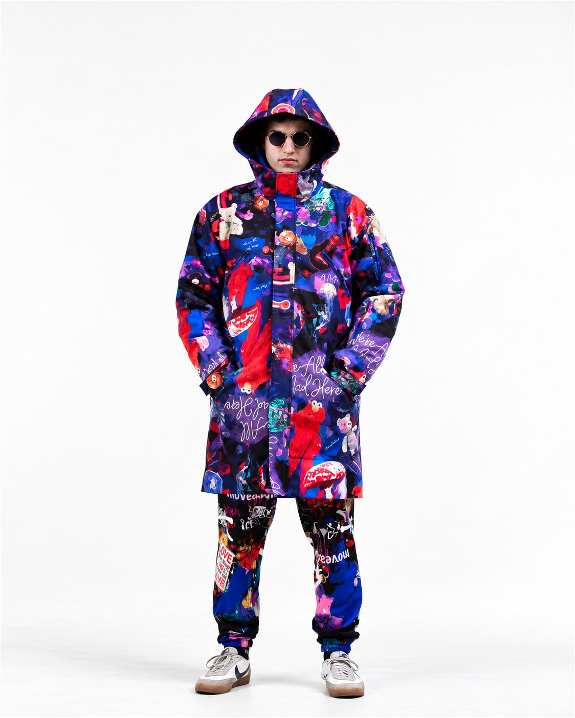 Man wearing MoveAddict Midnight Madness print winter parka with hood up – front view