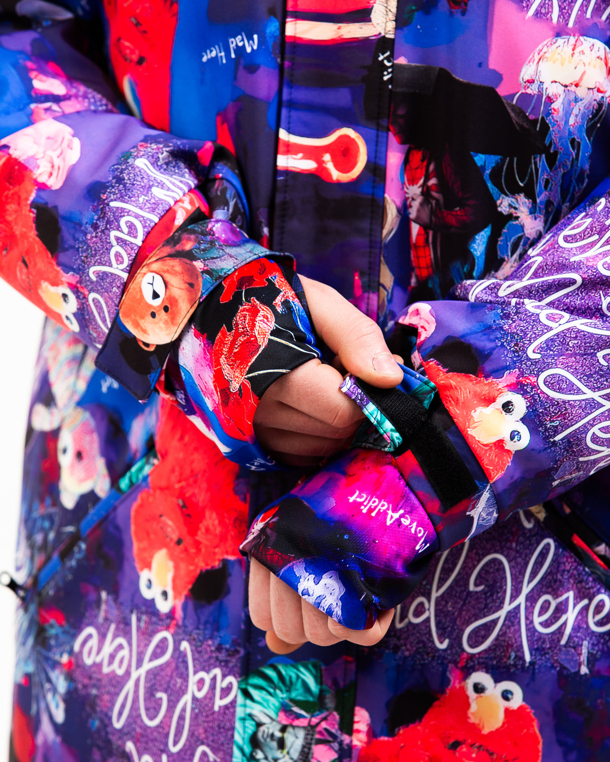 Cuff and hem detail on MoveAddict Midnight Madness print men's winter parka