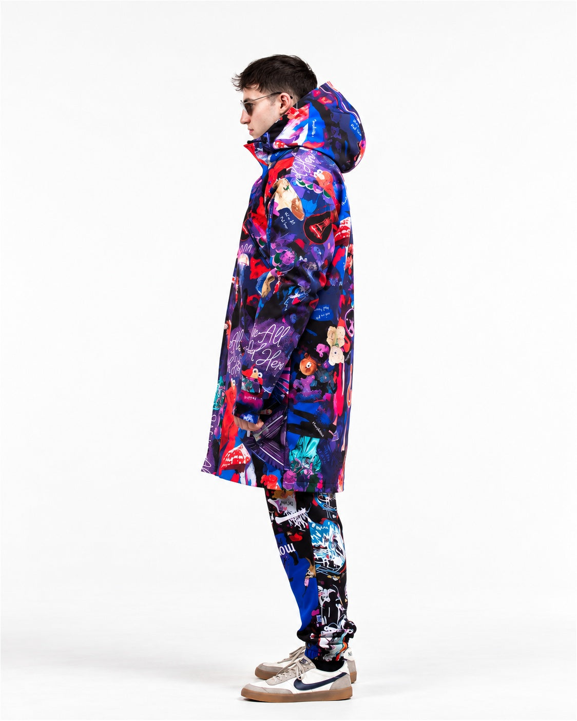Man wearing MoveAddict Midnight Madness print winter parka – side view