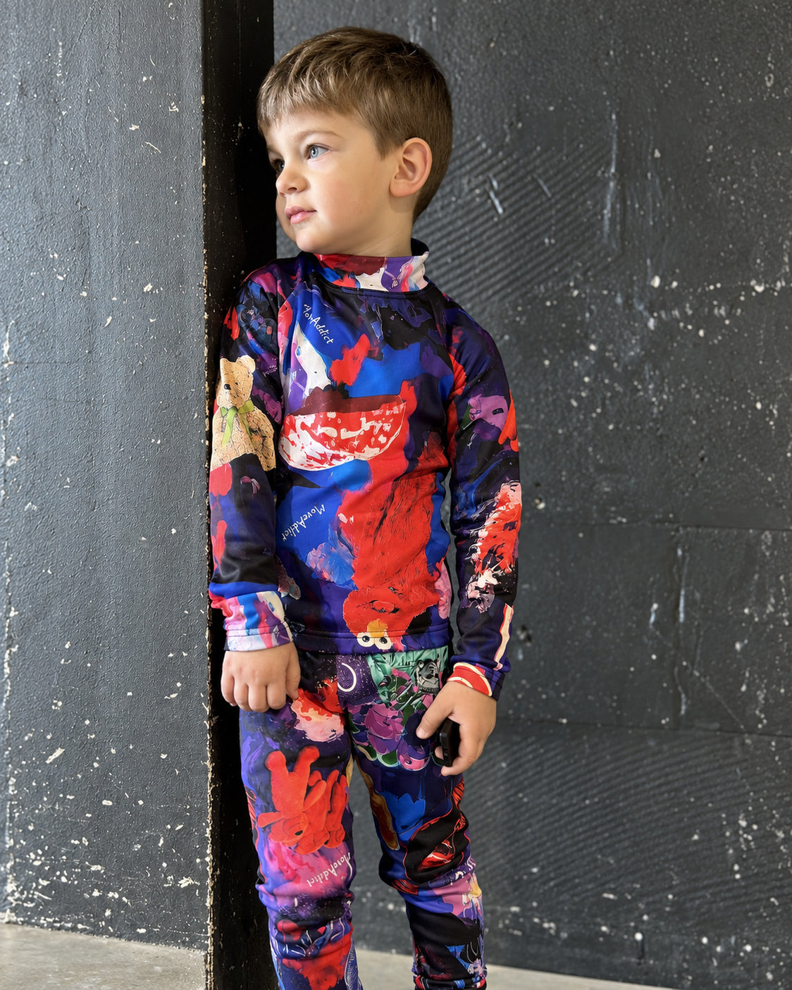 Child wearing MoveAddict Midnight Madness print kids' thermal top - portrait