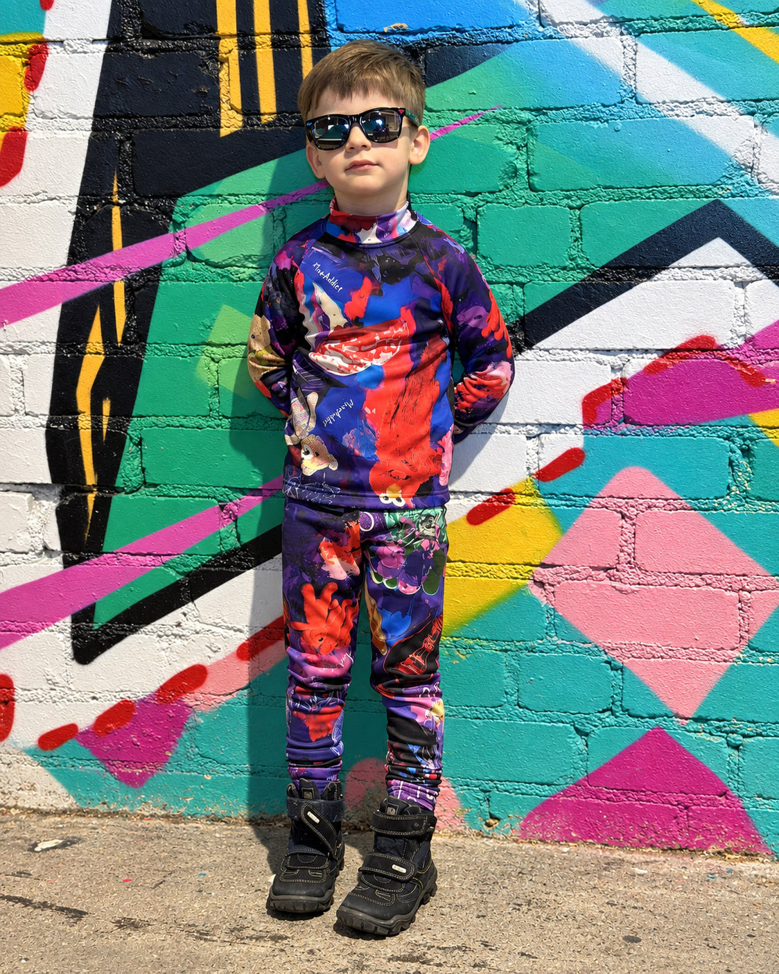 Child wearing MoveAddict Midnight Madness print kids' thermal leggings - front view, photo 2