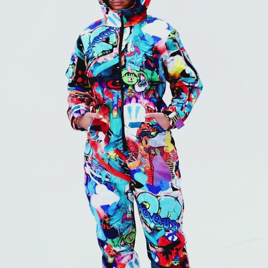Woman wearing MoveAddict Monster Party print one-piece snowboard and ski suit - product video